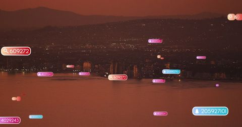 Digital Social Media Icons Scattering Across Tranquil Sunset Cityscape