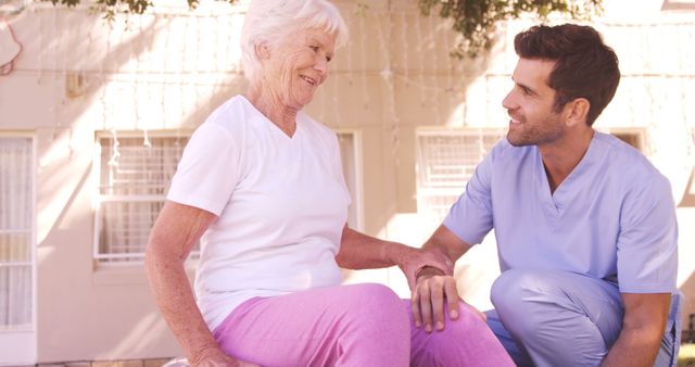 Caring Young Nurse Assisting Elderly Woman Outdoors - Download Free Stock Images Pikwizard.com
