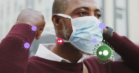 Person adjusting mask amid animated virus symbols