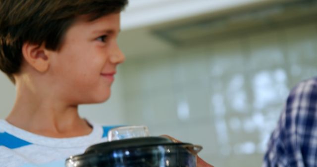 Smiling Boy Holding Blender Container in Kitchen - Download Free Stock Images Pikwizard.com