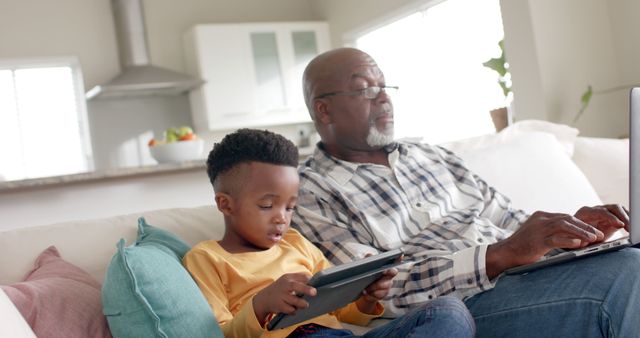 Grandfather and Grandson Together Using Devices at Home - Download Free Stock Images Pikwizard.com