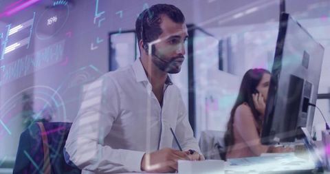 It specialist taking notes in modern open-plan office