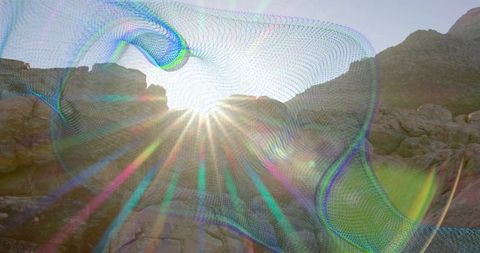 Sunlit rock formations with abstract digital mesh overlay