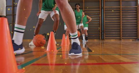 Youth basketball training with agility cones in gymnasium