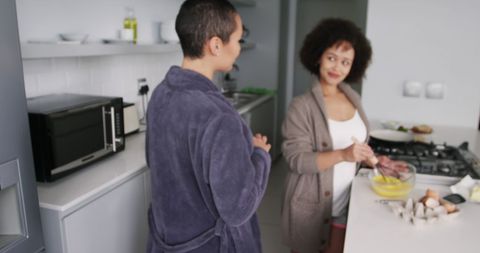 Happy Couple Preparing Breakfast Together in Modern Kitchen
