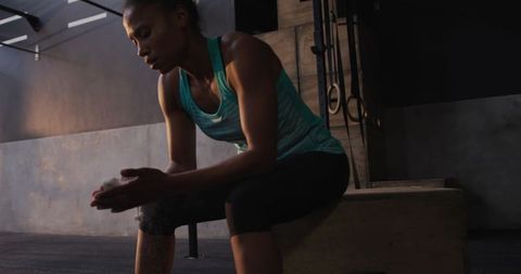 Athletic Woman Preparing with Chalk for Weightlifting Workout - Download Free Stock Images Pikwizard.com