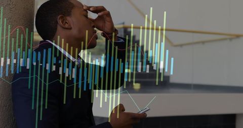 Stressed Businessman Checking Analytics on Smartphone