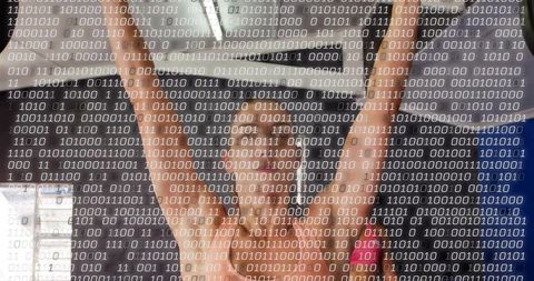 Fit woman stretching and raising arms in group workout with binary code digital overlay