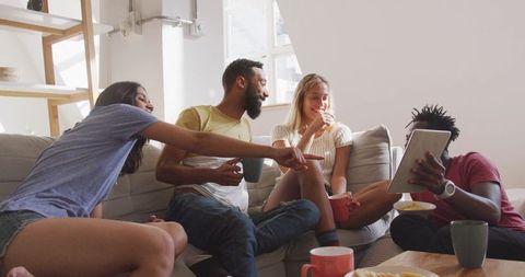 Diverse Group of Friends Relaxing Offortable Sofa with Snacks - Download Free Stock Images Pikwizard.com