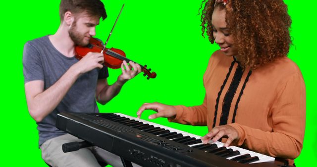Musicians playing violin and piano on green screen background, showcasing a diverse musical duo. Ideal for use in video editing, music production visuals, and advertisements promoting musical talent and collaboration.