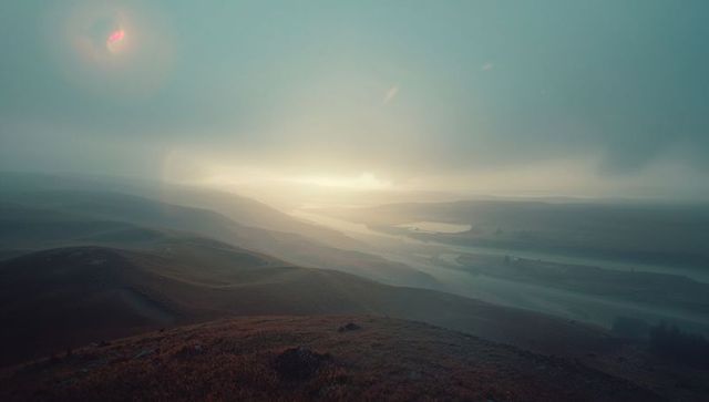 Misty Morning River Valley with Rolling Hills and Dawn Light