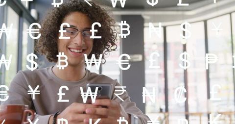 Young man tapping smartphone in cafe with floating currency symbols finance app concept