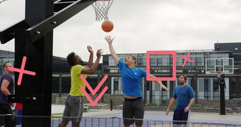 Friends Playing Basketball with Geometric Overlays in Park