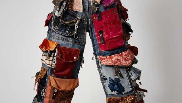 Upcycled patchwork utility pants showcasing multilayered pockets, zippers, snaps, buckles