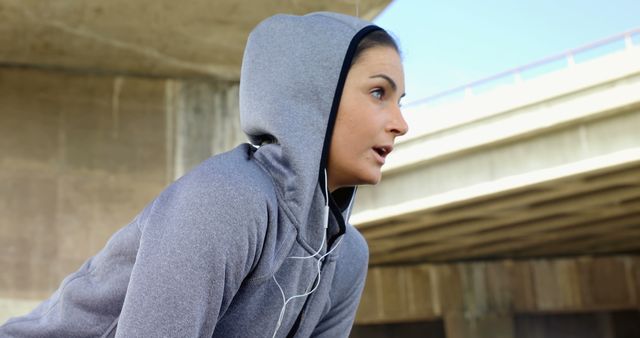 Young Fitness Woman in Hoodie Taking a Break During Outdoor Workout - Download Free Stock Images Pikwizard.com
