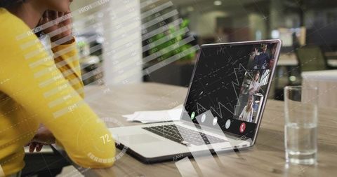 Businesswoman Engaging in Virtual Meeting at Office Desk