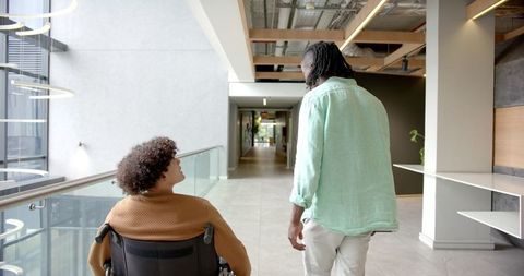 Colleagues Collaborating in Modern Office Hallway - Download Free Stock Images Pikwizard.com