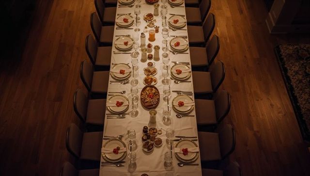 Overhead banquet table layout featuring elegant place arrangements and warm hardwood ambiance