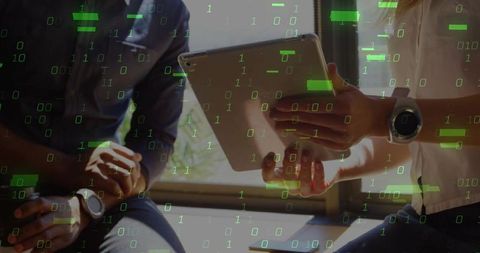 Colleagues Collaborating with Digital Technology in Office Setting