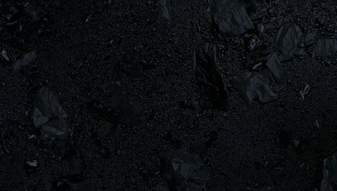 Obsidian Black Texture with Glossy Crumpled Fragments and Fine Granular Surface