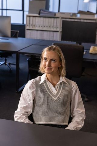 Confident Business Woman in Modern Office Setting