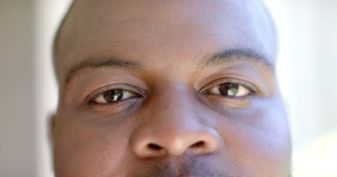 Intense Gaze: Man's Determined and Focused Expression Close-Up