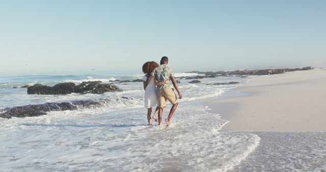 Young Couple Walking on Beautiful Beach Enjoying Summer Vacation - Download Free Stock Images Pikwizard.com