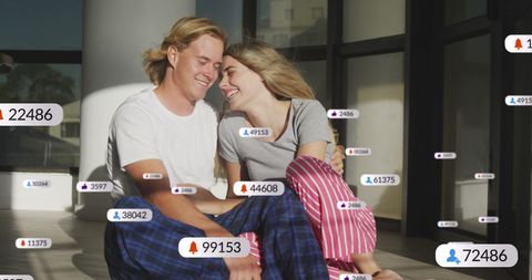 Smiling Couple Surrounded by Social Media Notifications