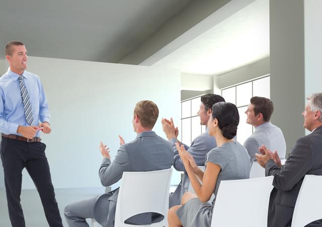 Businessman giving presentation in front of his colleagues in office