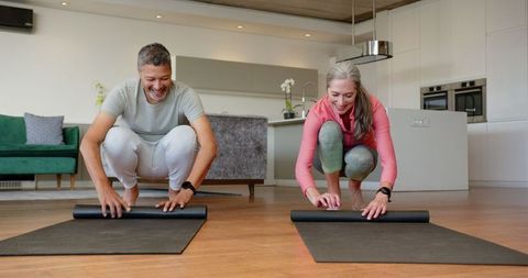 Senior Couple Embracing Fitness at Home with Yoga Mats