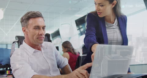 Colleagues Collaborating on Financial Data Analysis