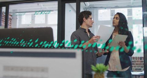 Collaboration Amidst Financial Data Screens in Modern Office