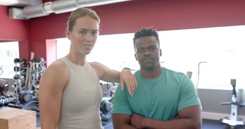 Fitness Pair Taking Break During Workout in Gym Environment