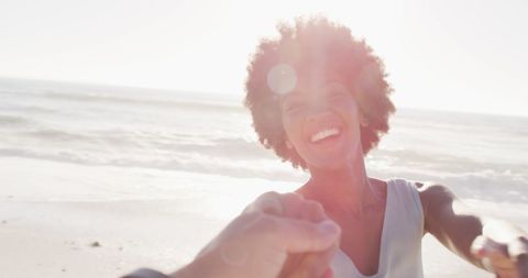 Joyful Woman Enjoying Relaxing Beach Day in Sunlight - Download Free Stock Images Pikwizard.com