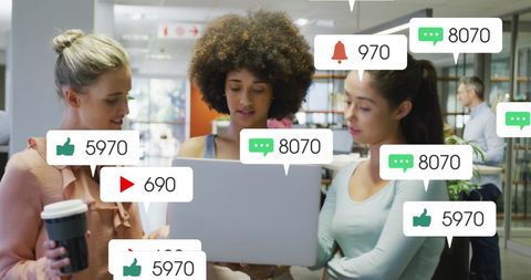 Diverse Team Analyzing Social Media Engagement Statistics in Modern Office