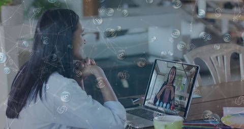 Biracial Woman Engaged in Virtual Meeting With Digital Connectivity Icons