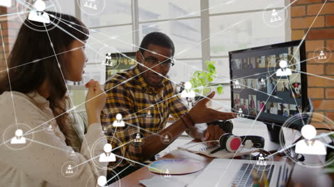Diverse Colleagues Discussing Digital Connections in Modern Office