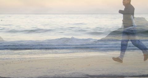 Man Enjoying Morning Run Along Serene Beach with Gentle Waves - Download Free Stock Images Pikwizard.com