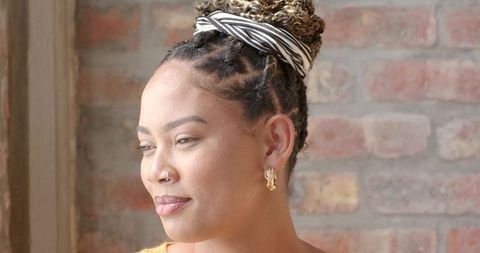African American Woman with Braided Updo by Window