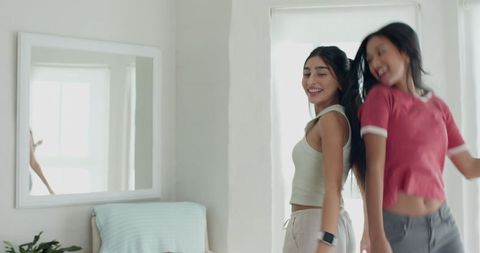 Happy Female Friends Enjoying Time Together at Home