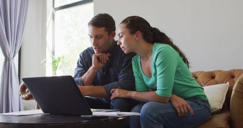 Couple Managing Finances Using Laptop Together in Living Room - Download Free Stock Images Pikwizard.com