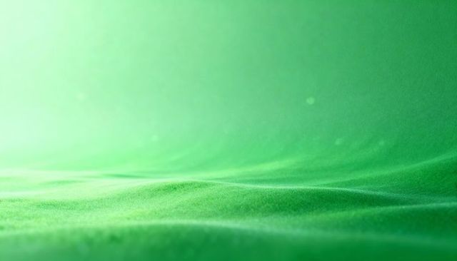 Soft green fabric texture showing gentle folds, micro-weave and dreamy bokeh gradient
