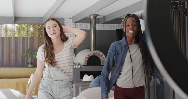 Two Friends Recording video in modern Living Room, Smiling and Having Fun - Download Free Stock Images Pikwizard.com