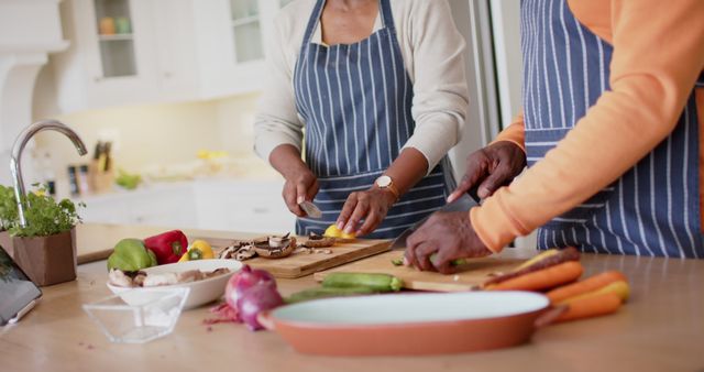 Senior Couple Preparing Vegetables Together in Modern Kitchen - Download Free Stock Images Pikwizard.com