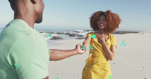 Couple embracing eco-friendly lifestyle by ocean