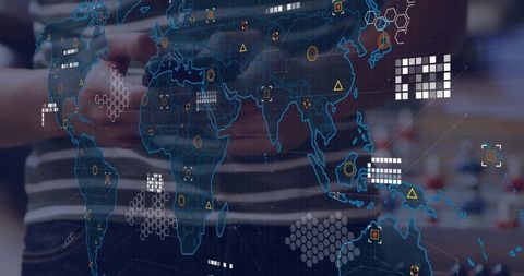 Asian man holding device interacting with futuristic data hud and geospatial overlay