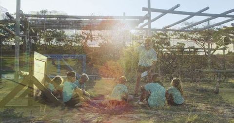 Outdoor Learning by Campfire: Instructor and Children Engage in Nature