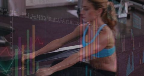 Rowing Woman Powering Stroke with Performance Data Overlay on Indoor Ergometer