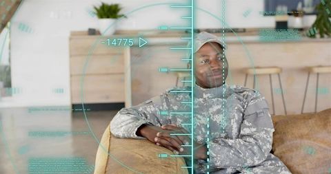 Relaxing soldier leaning on sofa with futuristic hud overlay, home lifestyle and tech