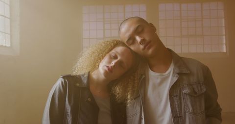 Peaceful Interracial Couple in Serene Indoor Lighting